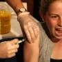 Young woman gets a cervical cancer vaccine shot