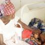 African mother cares for sick child