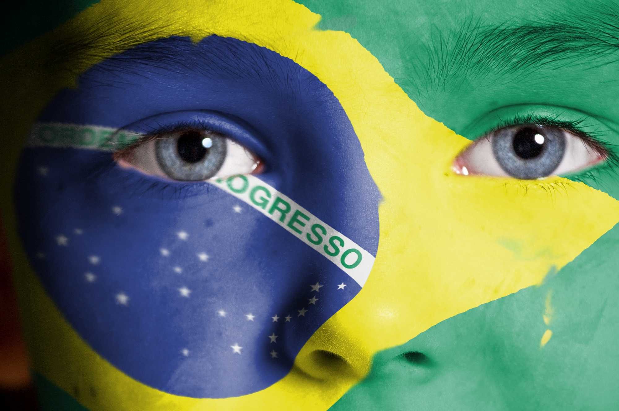 Face painted with Brazilian flag