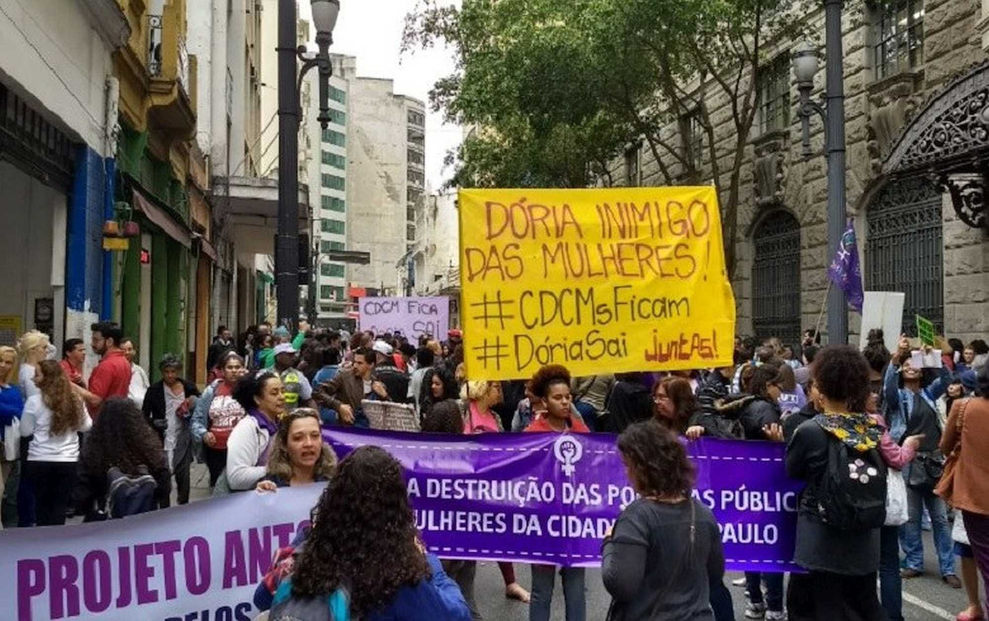 The protesters' banner accuses Doria of being an enemy of the women