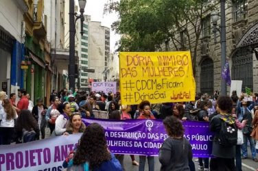 The protesters' banner accuses Doria of being an enemy of the women