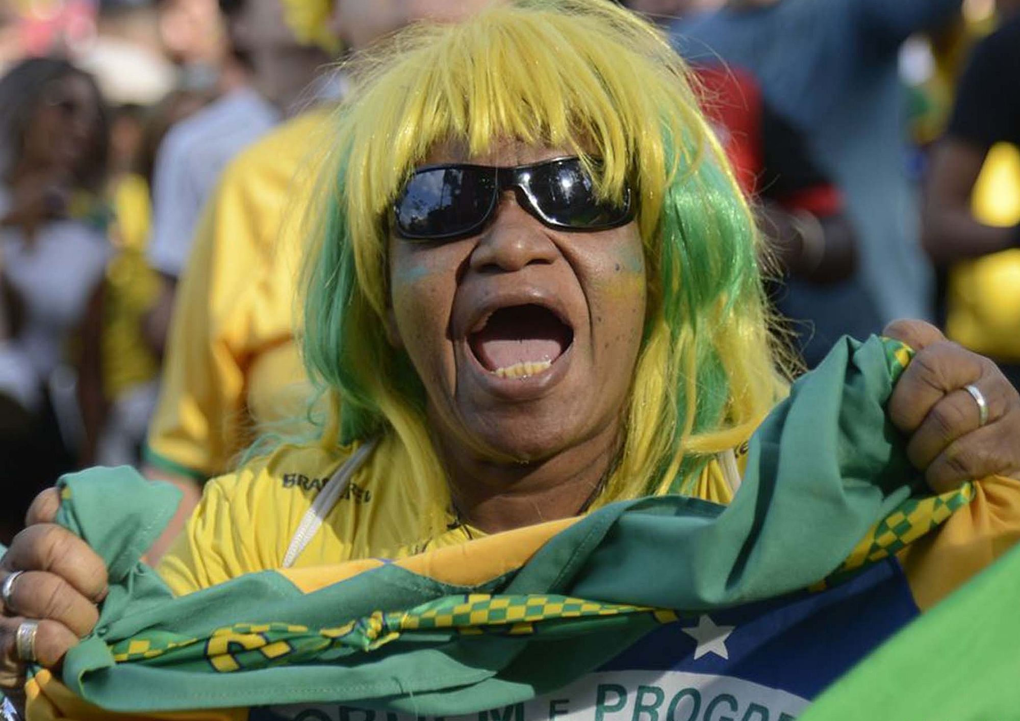 A Brazilian fan rooting for the Brazilian team - Photo by Tomaz Silva