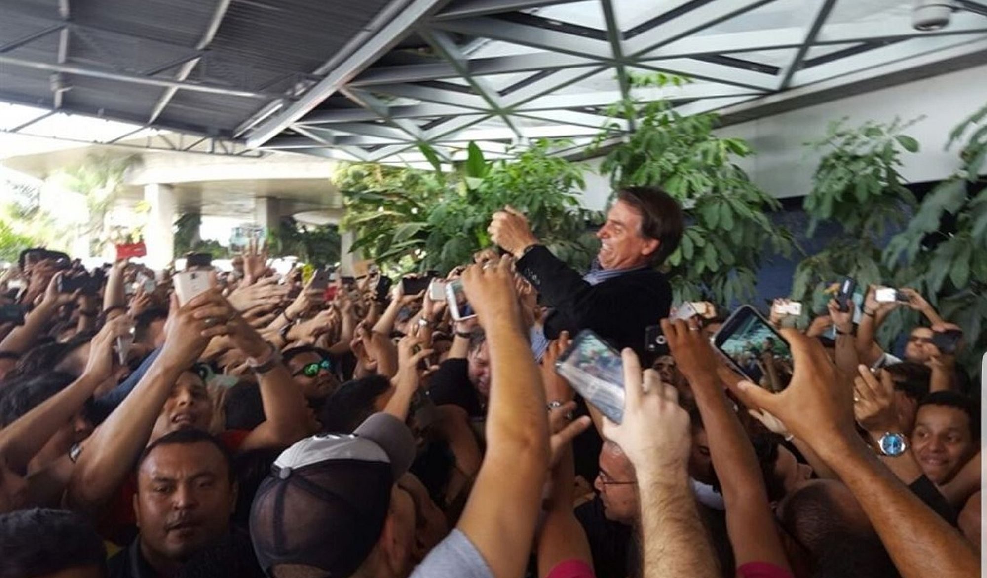 House representative Jair Bolsonaro being carried by fans
