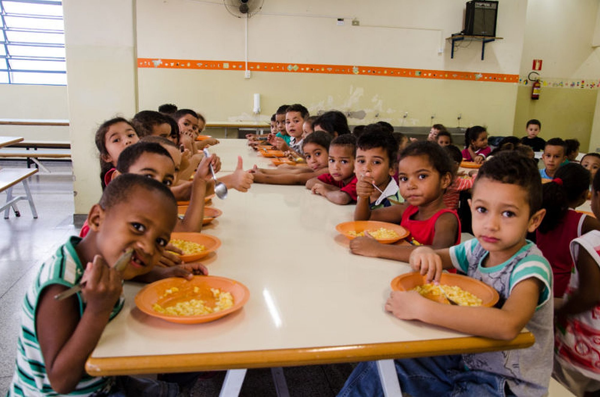 Brazilian children at school at lunchtime.