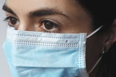 A nurse wearing a mask