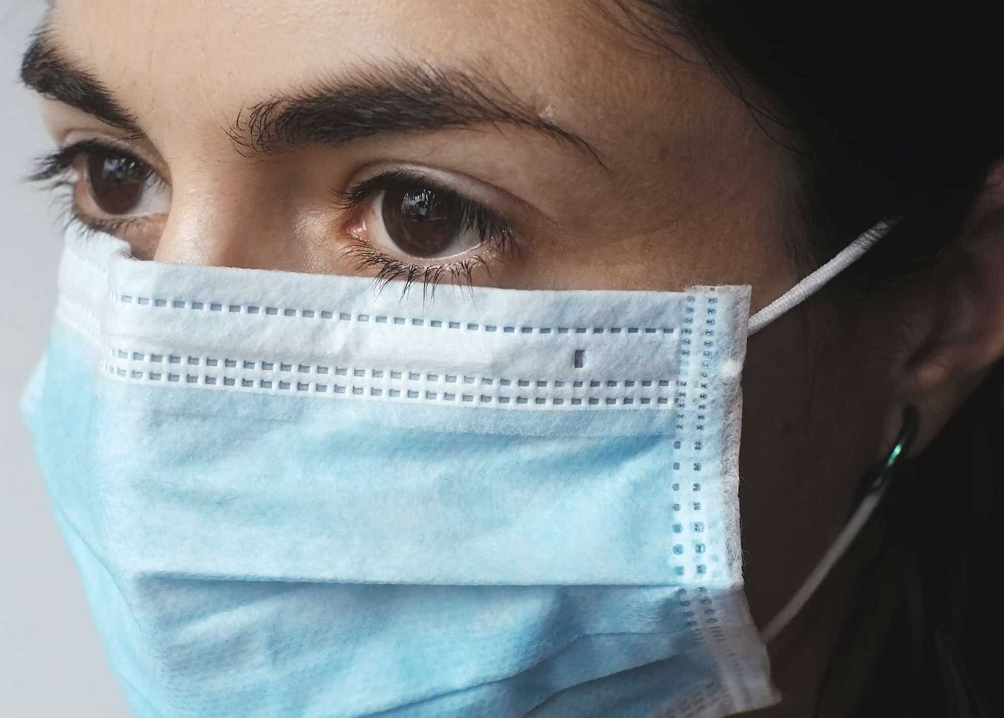 A nurse wearing a mask