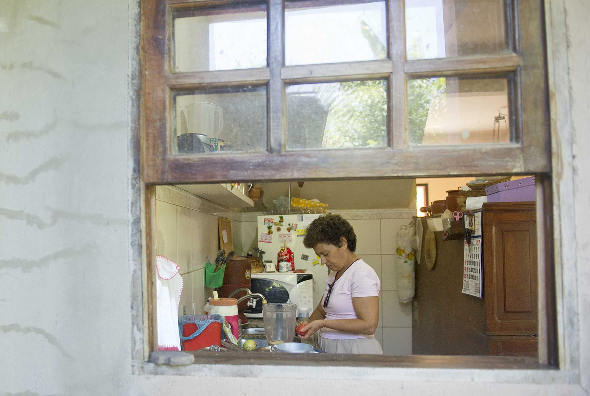 A housewife at her kitchen in a Rio de Janeiro favela