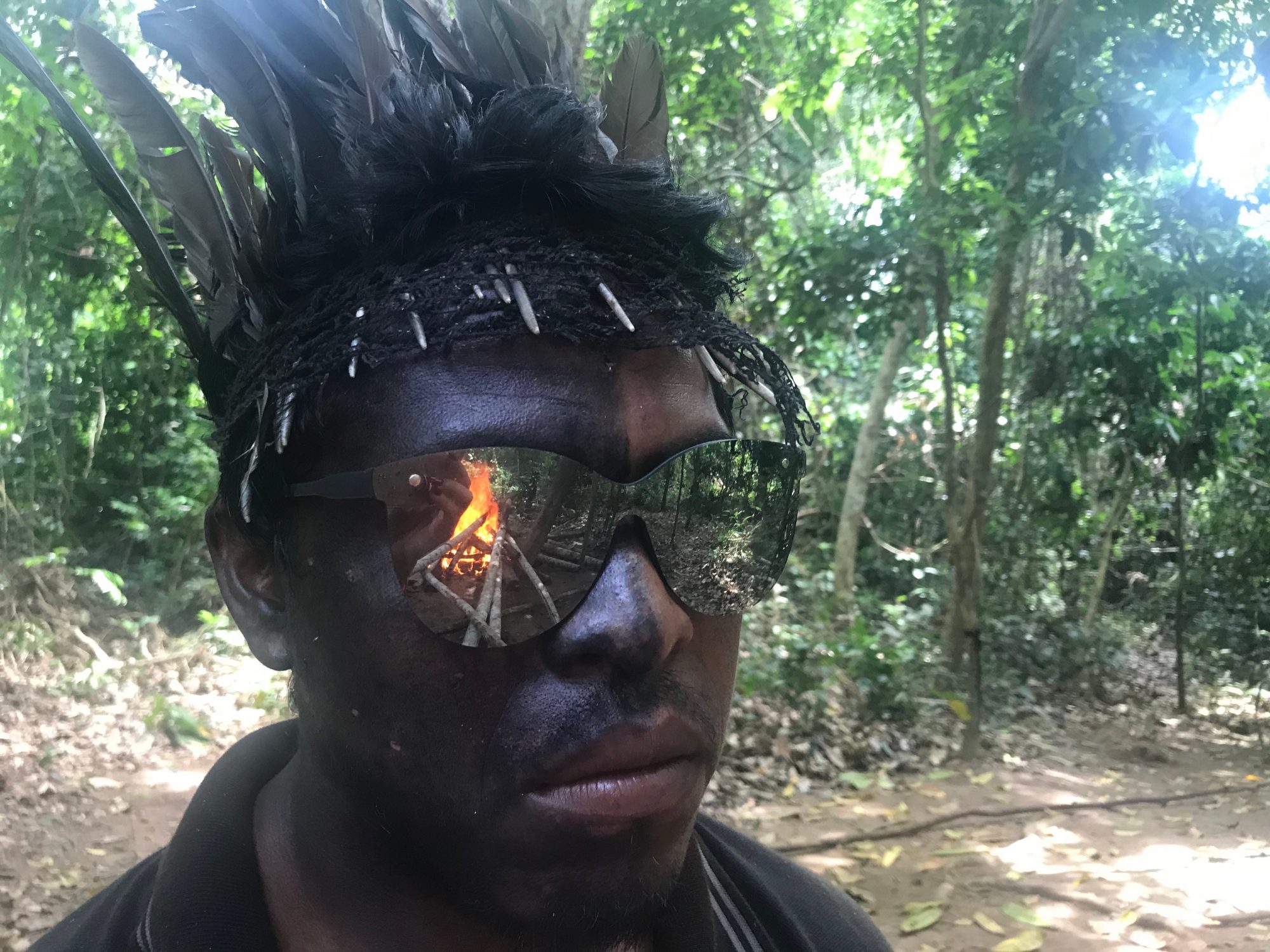 Forest Guardian Paulo Guajajara watches a loggers shack burn - Thomson Reuters Foundation/Max Baring