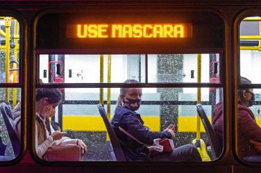 Sign in Curitiba, Brazil, bus says: "Wear a mask."