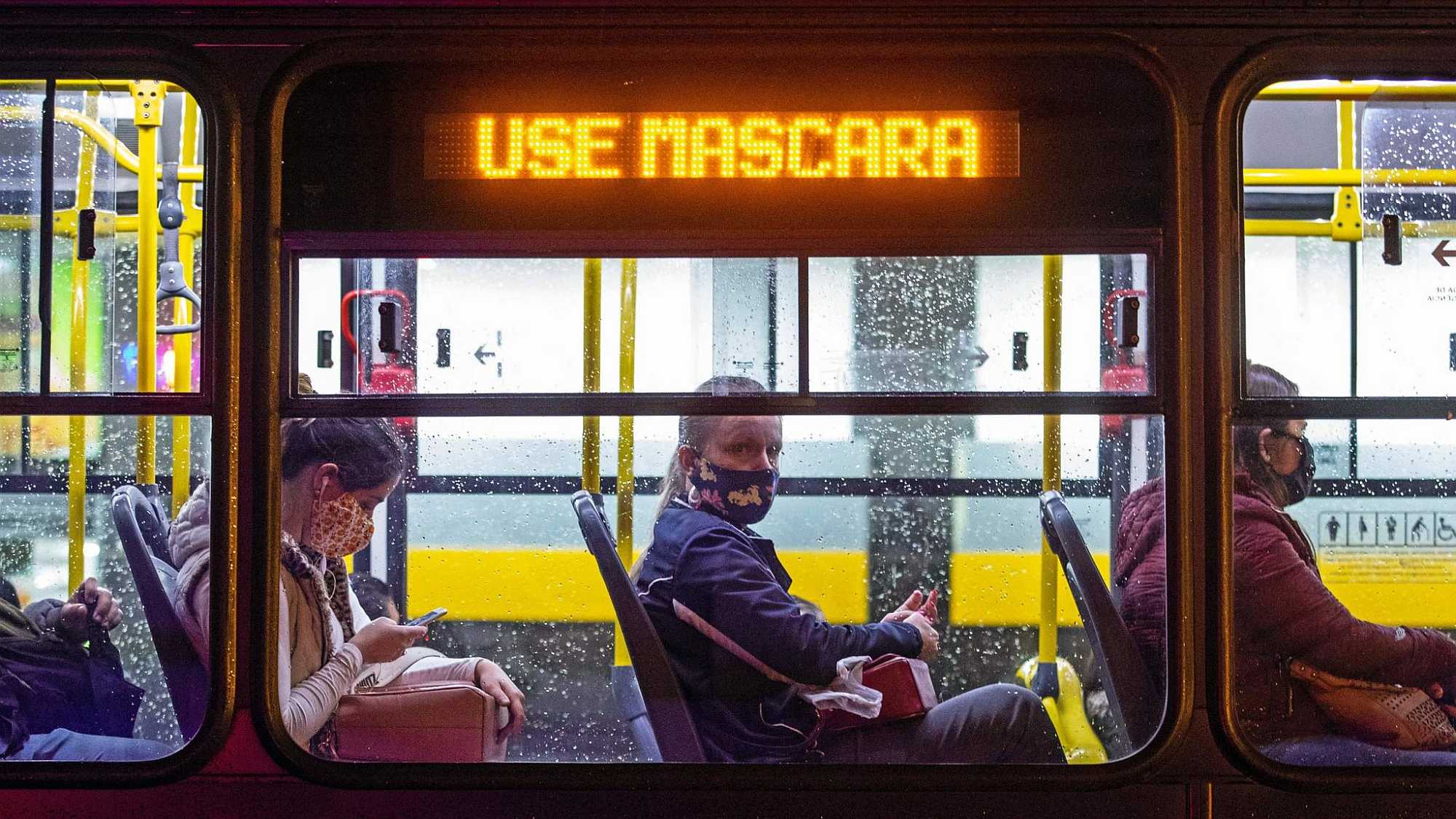 Sign in Curitiba, Brazil, bus says: "Wear a mask."