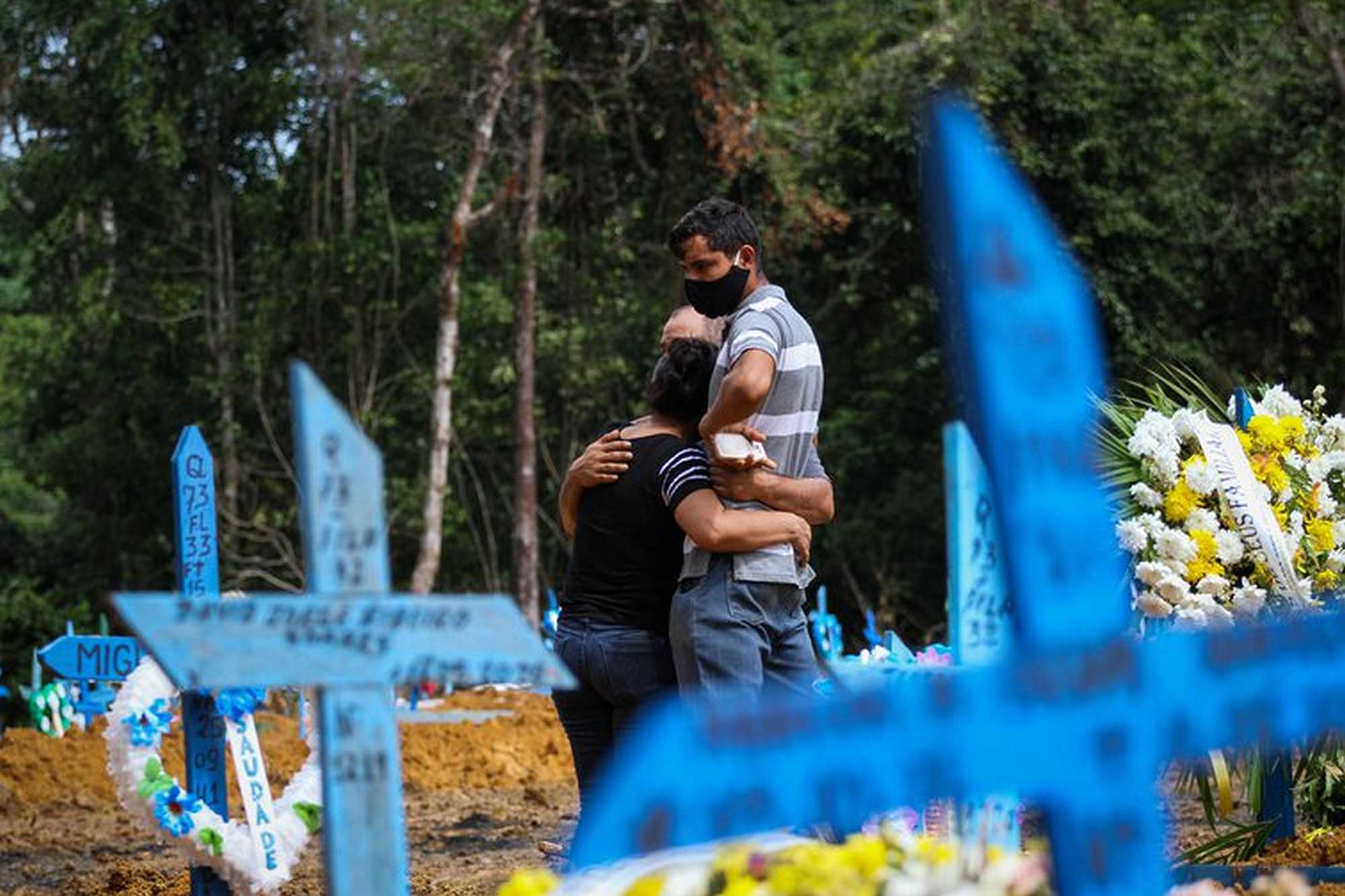 Family members embrace at a funeral in Manaus, Brazil | Lucas Silva/dpa/Alamy Live News