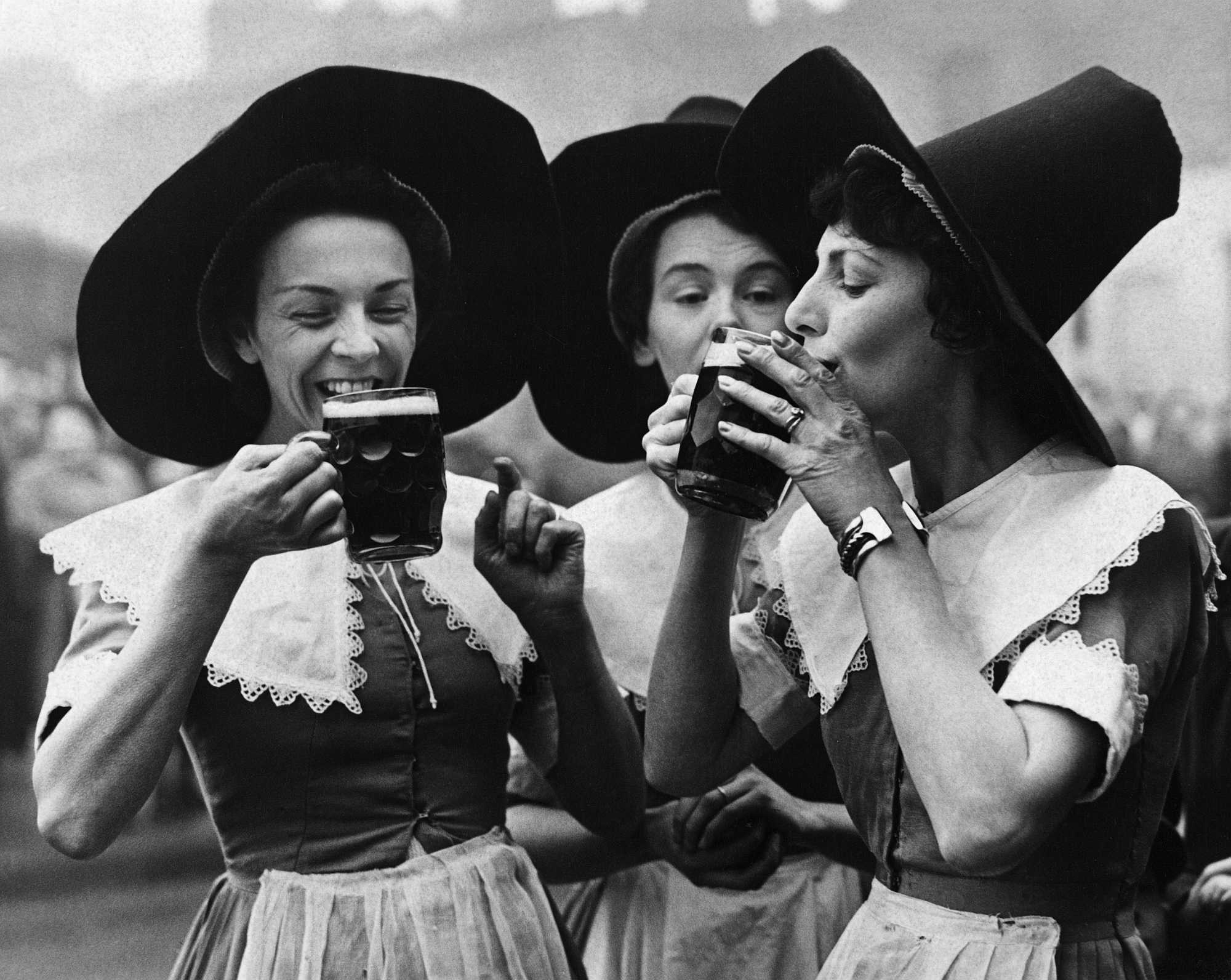 Three women dressed in period garb as alewives. The tall hats became a part of witch iconography. Hulton-Deutsch Collection/Corbis via Getty Images