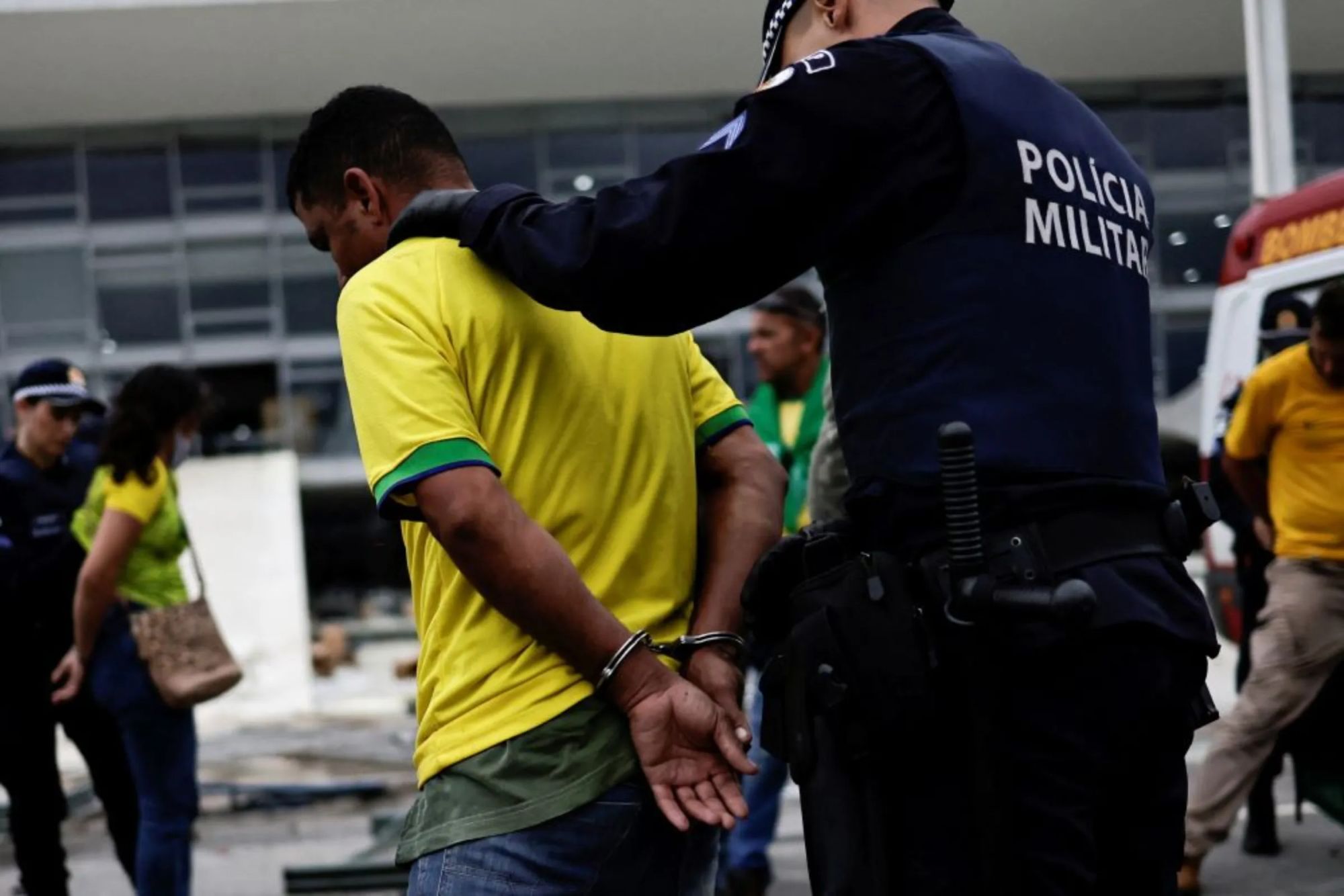 A supporter of Bolsonaro is detained during a demonstration against President Lula in Brasilia, January 8, 2023. REUTERS/Ueslei Marcelino