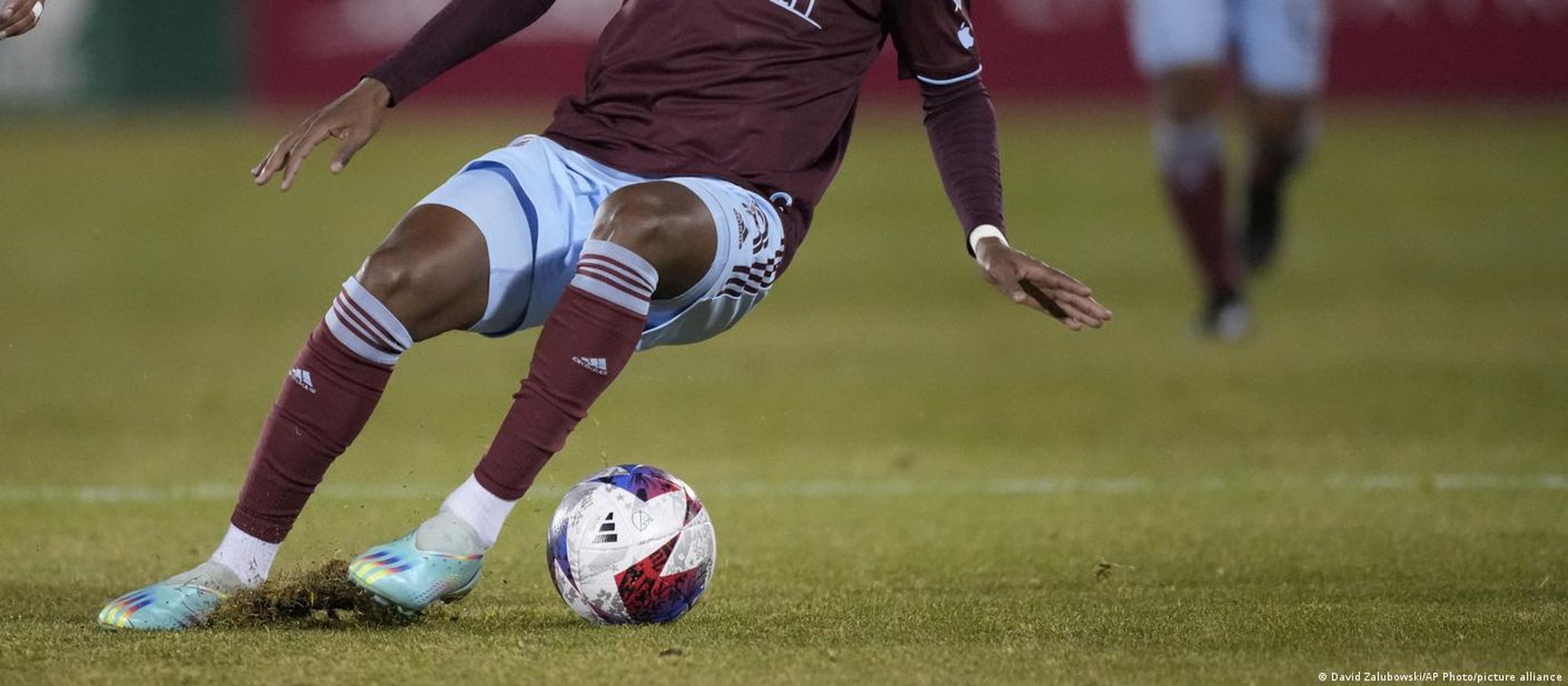 A Braziliian football player is seeen dribbling the ball. Image: David Zalubowski/AP Photo/picture alliance