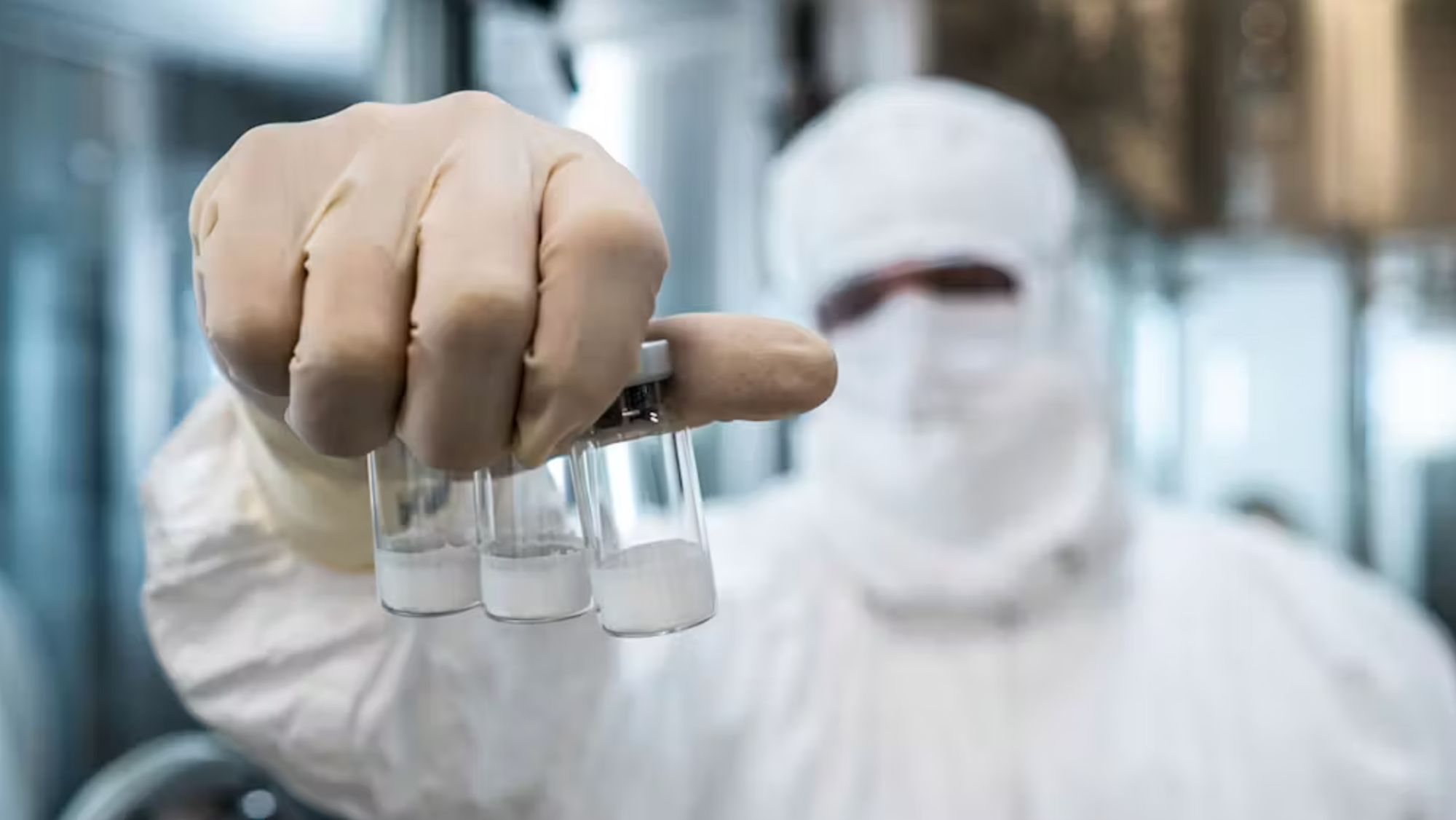 A technician holds vials of Butantan-DV’s lyophilised formulation. Butantan
