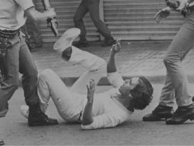 A protester being beaten by the police during the dictatorship