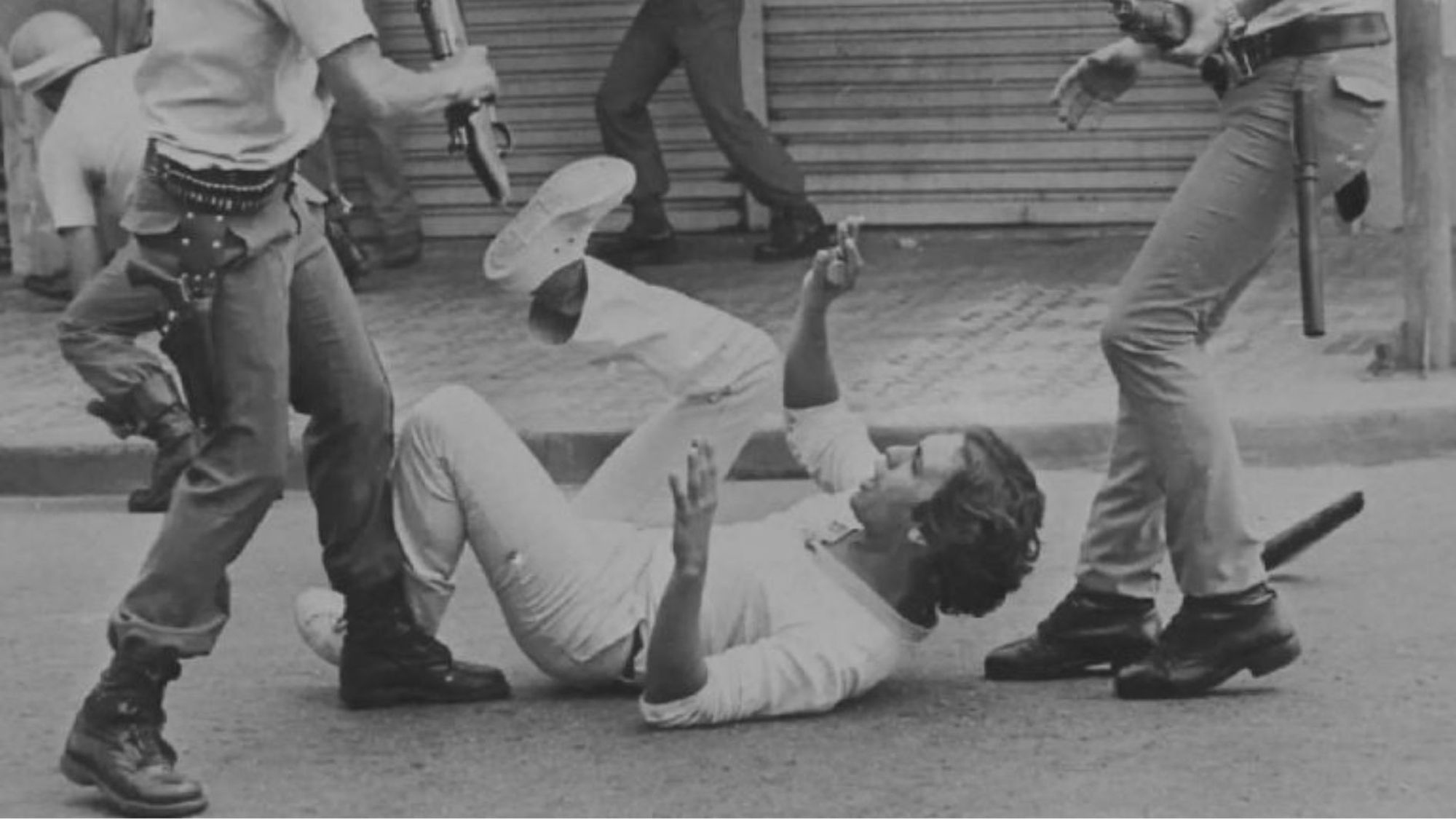 A protester being beaten by the police during the dictatorship